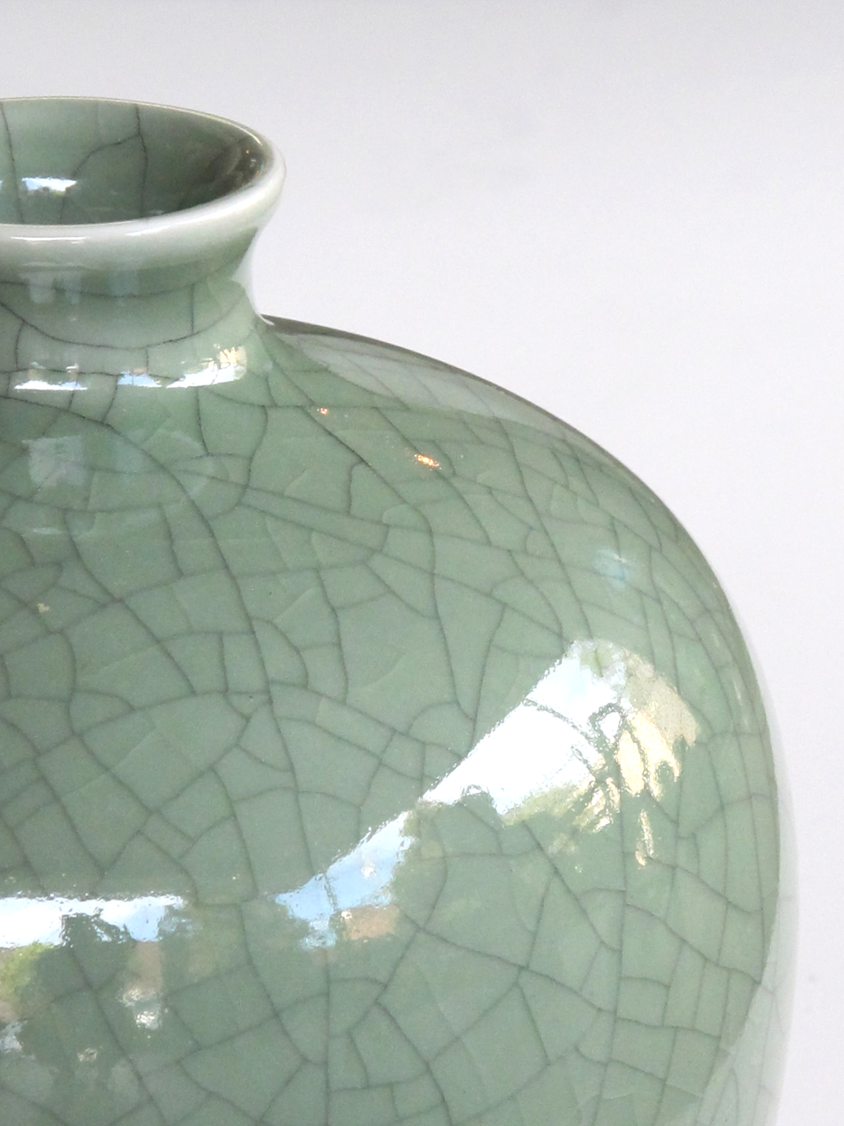 an elegantly-shaped chinese celadon crackle-glazed mei ping (plum