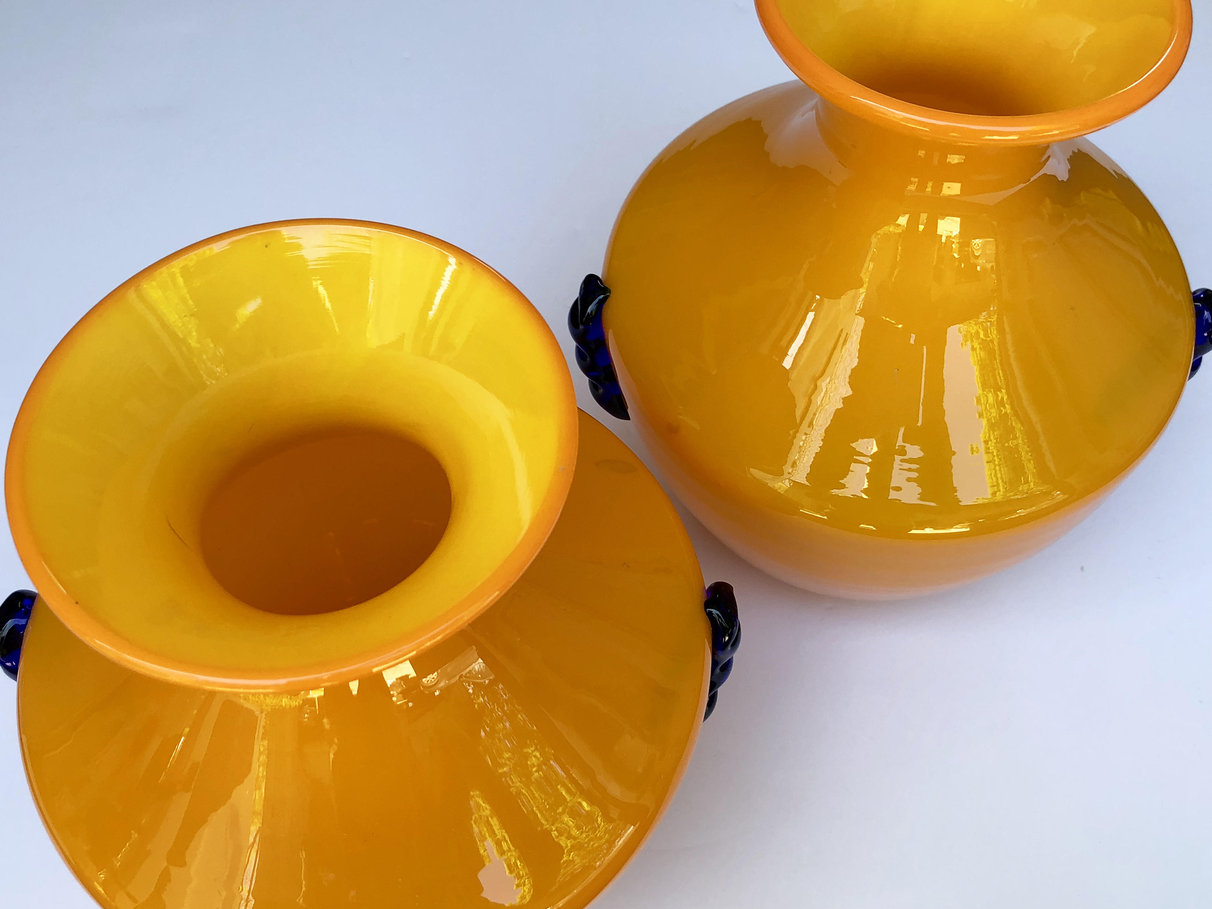 a rare pair of blenko orange glass vases with applied cobalt decoration