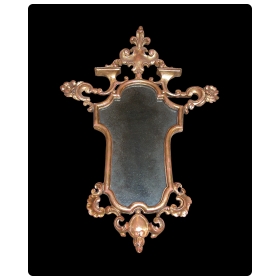 a finely carved french napoleon iii  giltwood cartouche-shaped mirror