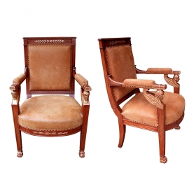 a good pair of french empire fruitwood and parcel-gilt armchairs with sphinx-head motifs