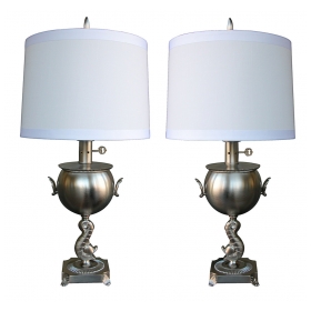 a stylish pair of american art deco brushed-nickel plated lamps with dolphin support