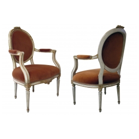 pair of swedish gustavian style ivory painted and parcel-gilt oval-back armchairs