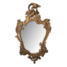 a curvaceous italian rococo style cartouche-shaped carved giltwood mirror