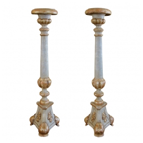 a large-scaled pair of italian neoclassical pale green painted and parcel-gilt carved candlesticks