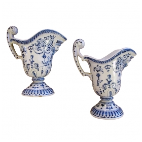 a good pair of french blue and white tin-glazed faience pitchers or ewers; probably Rouen