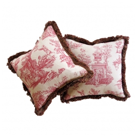 a sumptuous pair of burgundy and ivory toile pillows with silk fringe