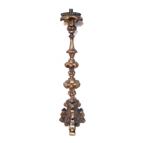 a boldly-scaled italian baroque carved giltwood candlestick