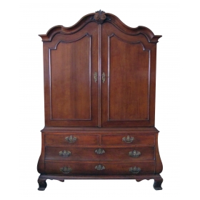 a handsome and warmly-patinated dutch rococo bombe-form carved oak two-door cabinet