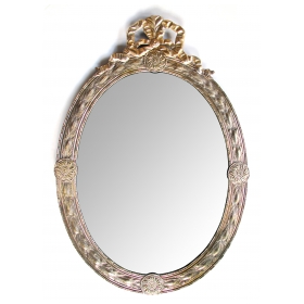 a handsome and large-scaled continental neoclassical style silver repousse oval mirror