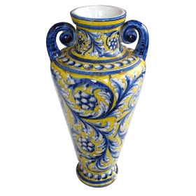 a thickly-modeled italian tin-glazed earthenware polychrome (majolica) double handled vase; possibly florence