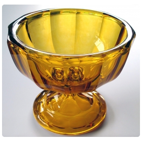 a heavy and thickly-modeled bohemian mid-century pedestal bowl of honey-colored glass; by moser glassworks