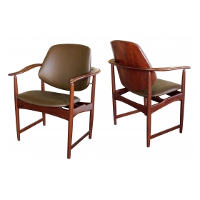 a mod pair of danish arne hovman-olsen 1960's teak armchairs with leather upholstery