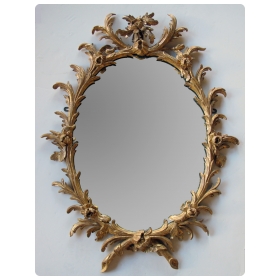 good quality english george II rococo giltwood oval foliate-carved mirror