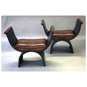 unique and boldly-scaled french industrial iron curule-form benches with faux alligator leather seats