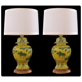 a stunning and richly-colored pair of mid-century chinese canary yellow ginger jars with dark green decoration now mounted as lamps