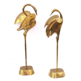 a graceful pair of stylized solid brass cranes