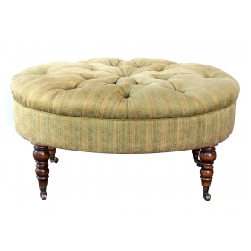 handsome english late 19th century oval ottoman/stool with turned legs and casters 