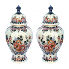 well-executed pair of delft polychromed hand-painted covered jars signed by the artist P. Verhoeve