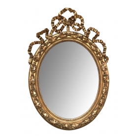 A French Napoleon III Giltwood and Composite Oval Mirror with Ribbon Crest and Oak Leaf Border