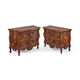 Pair of Louis XV provincial style walnut commodes, angled front view