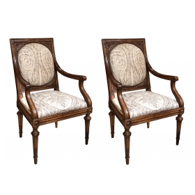 an exquisite and large-scaled pair of italian neoclassical carved walnut upholstered arm chairs