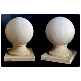 a massive and stately pair of french carved limestone orb-form garden elements