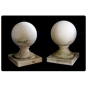 a stately pair of french neoclassical style carved limestone orb-form garden elements
