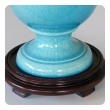 a striking and robust pair of french art deco turquoise crackle-glazed urns now mounted as lamps