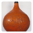 a large and iconic american 1960's burnt-orange crater-glazed lamp