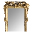 an ornately carved french rococo gilt-wood mirror with exuberant crest