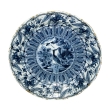 a boldly-scaled dutch delft blue and white charger with lobed rim