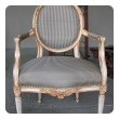 pair of swedish gustavian style ivory painted and parcel-gilt oval-back armchairs