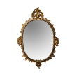 an elegantly carved  french louis XV rococo giltwood oval mirror