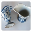 a good pair of french blue and white tin-glazed faience pitchers or ewers; probably Rouen