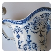 a good pair of french blue and white tin-glazed faience pitchers or ewers; probably Rouen