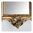 an ornately carved french rococo gilt-wood mirror with exuberant crest