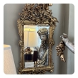 n ornately carved french rococo gilt-wood mirror with exuberant crest