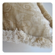 a sumptuous pair of ivory cut-velvet silk pillows with cotton fringe