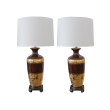 a richly-colored pair of american 1960's chocolate-brown ceramic lamps with fine gilt decoration