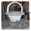 boldly-scaled french faux basket-weave concrete jardinière with arching handle