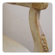 french regence style ivory painted and parcel-gilt open arm chair