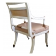 a stylish pair of 1940's hollywood regency ivory-painted and parcel-gilt klismos arm chairs