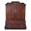 a handsome and warmly-patinated dutch rococo bombe-form carved oak two-door cabinet