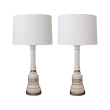 a stylish pair of american 1960's baluster-form white opaline glass lamps with gilt greek key design