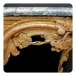 a curvaceous and finely carved french regence giltwood console table with grape vine motif and sage green marble top