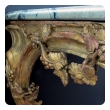a curvaceous and finely carved french regence giltwood console table with grape vine motif and sage green marble top