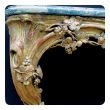 a curvaceous and finely carved french regence giltwood console Tables with grape vine motif and sage green marble top