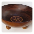 a richly-patinated english rosewood treenware bowl with inlaid star motif