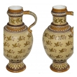 a good quality pair of german mettlach pottery ewers; each with impressed maker's mark; dated 1893
