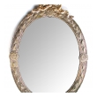 a handsome and large-scaled continental neoclassical style silver repousse oval mirror